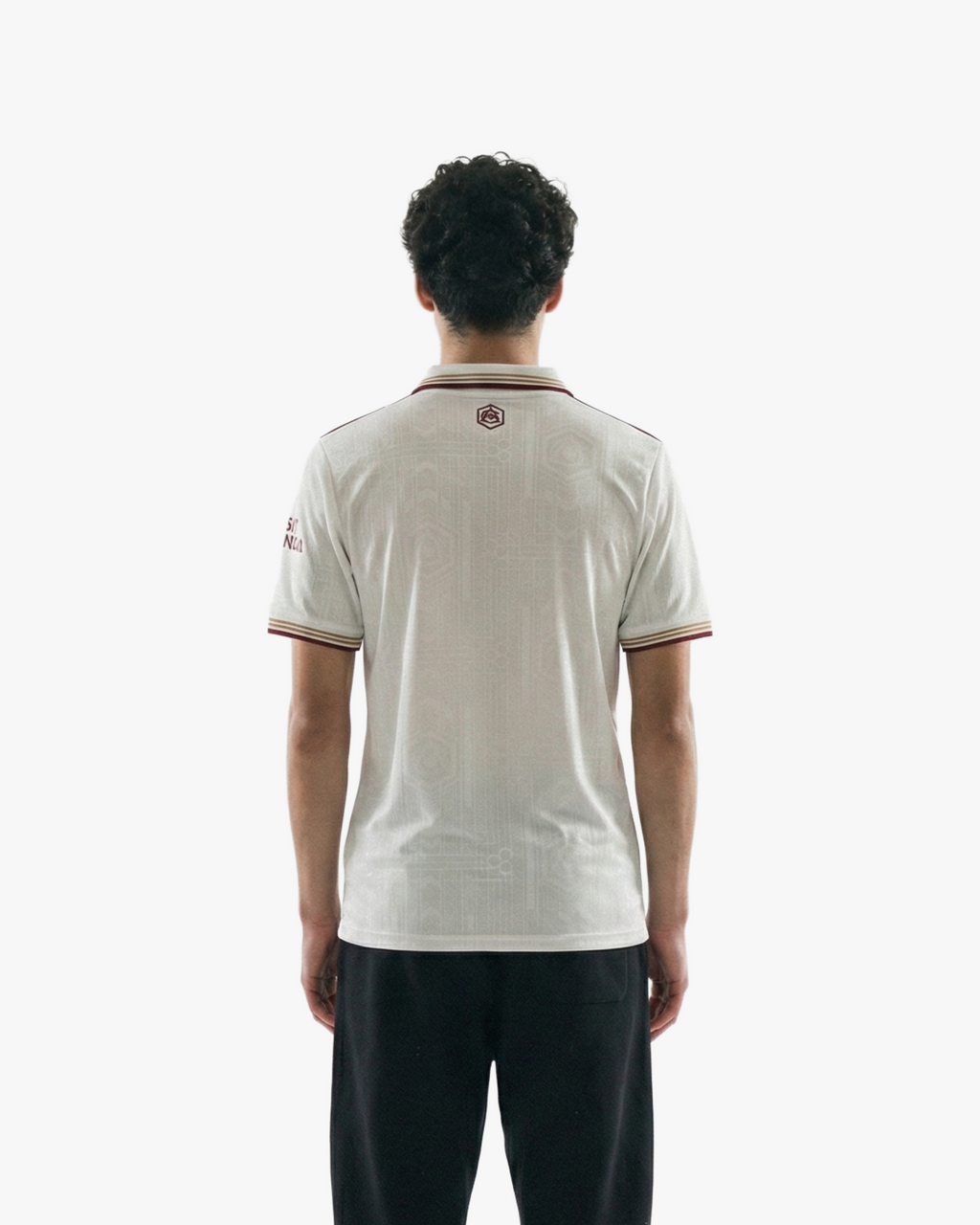 Back view of the Embroidered Arsenal Third Jersey 2025-26 on model, highlighting the athletic fit and clean red-on-white detailing.