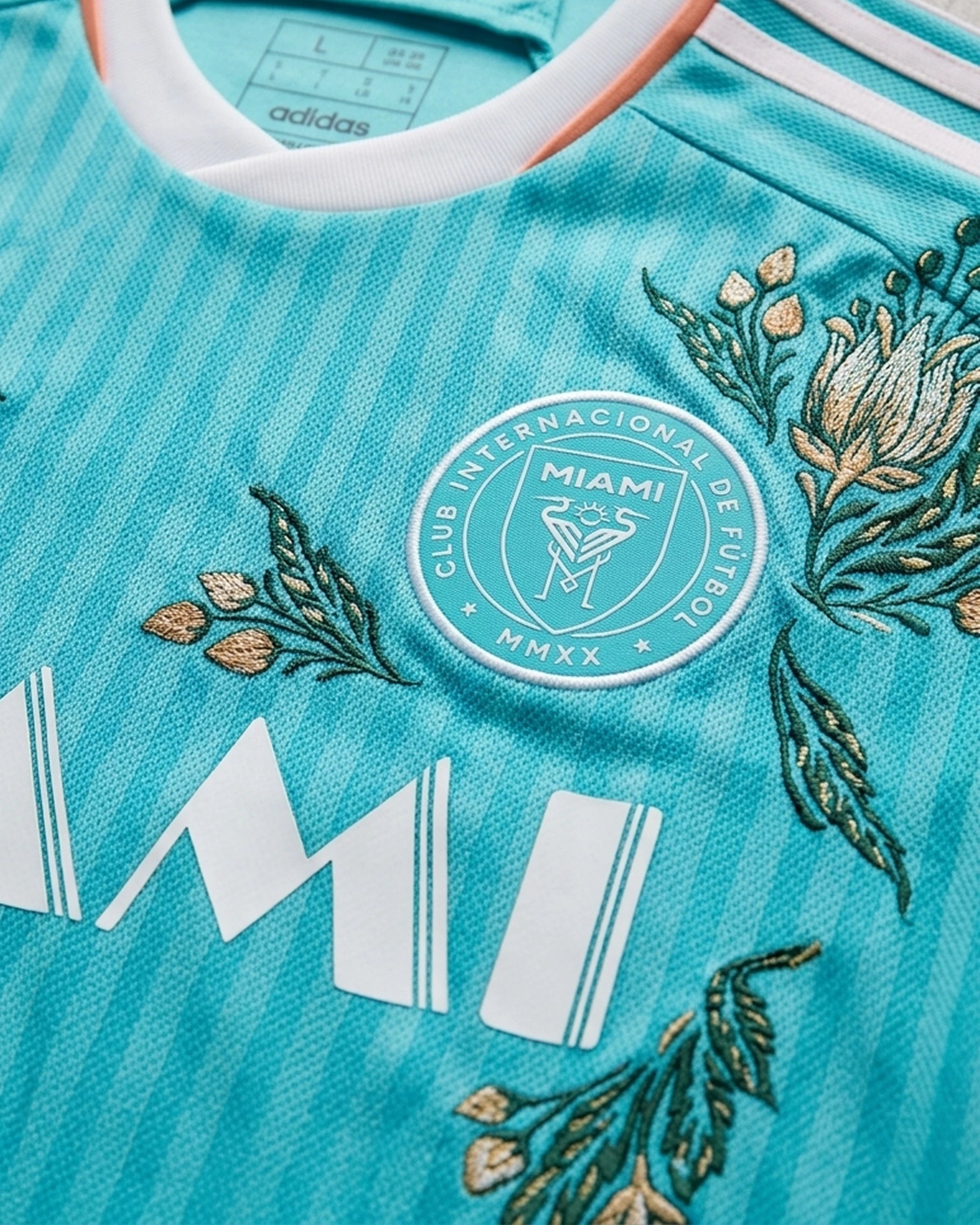 Close-Up Of High-Density Floral Embroidery Threads Intertwining On The Premium Inter Miami Blue Jersey.