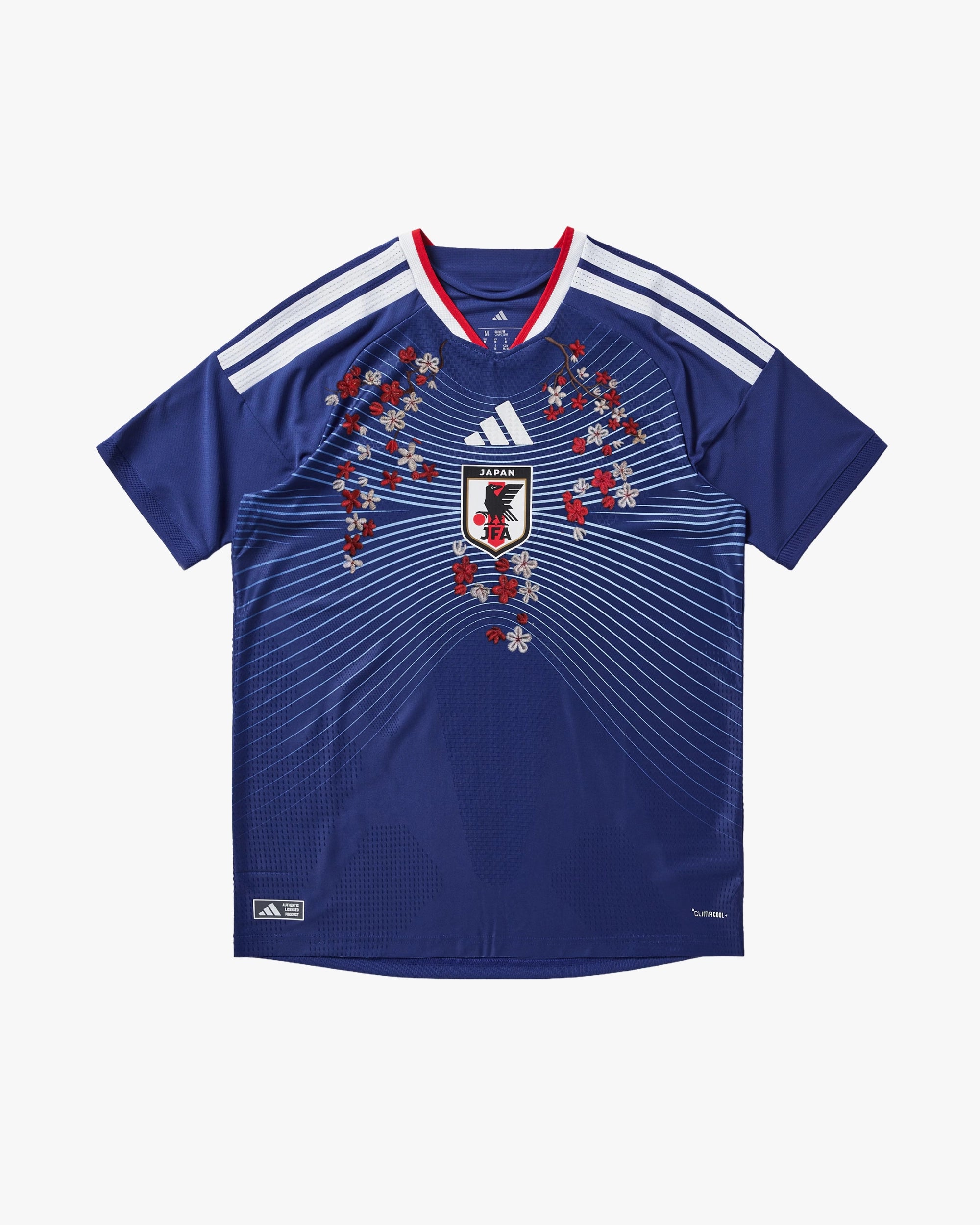 Front View Of The Japan 'Blue Lock Project' Edition Concept Jersey Featuring Intricate Gold Hand-Embroidery On The Classic Blue Kit.